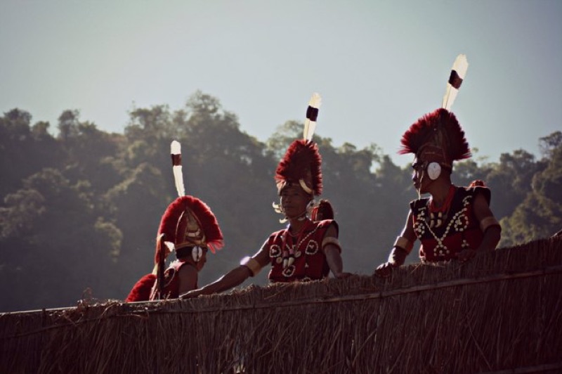 Naga tribal warriors performing traditional dance during the Hornbill Festival at Kisama Heritage Village near Kohima, Nagaland
