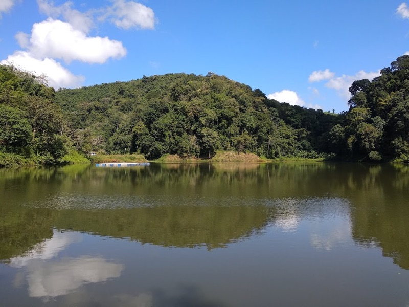 Tam Dil Lake surrounded by lush green hills in Mizoram